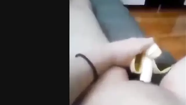 Asian girl masturbates with a banana